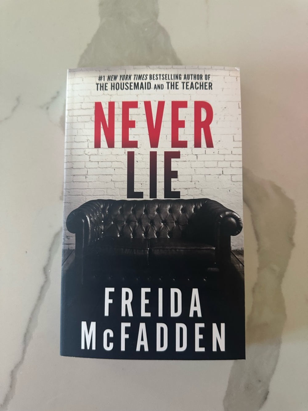 Never Lie by Freida McFadden – Black & White Thriller Paperback